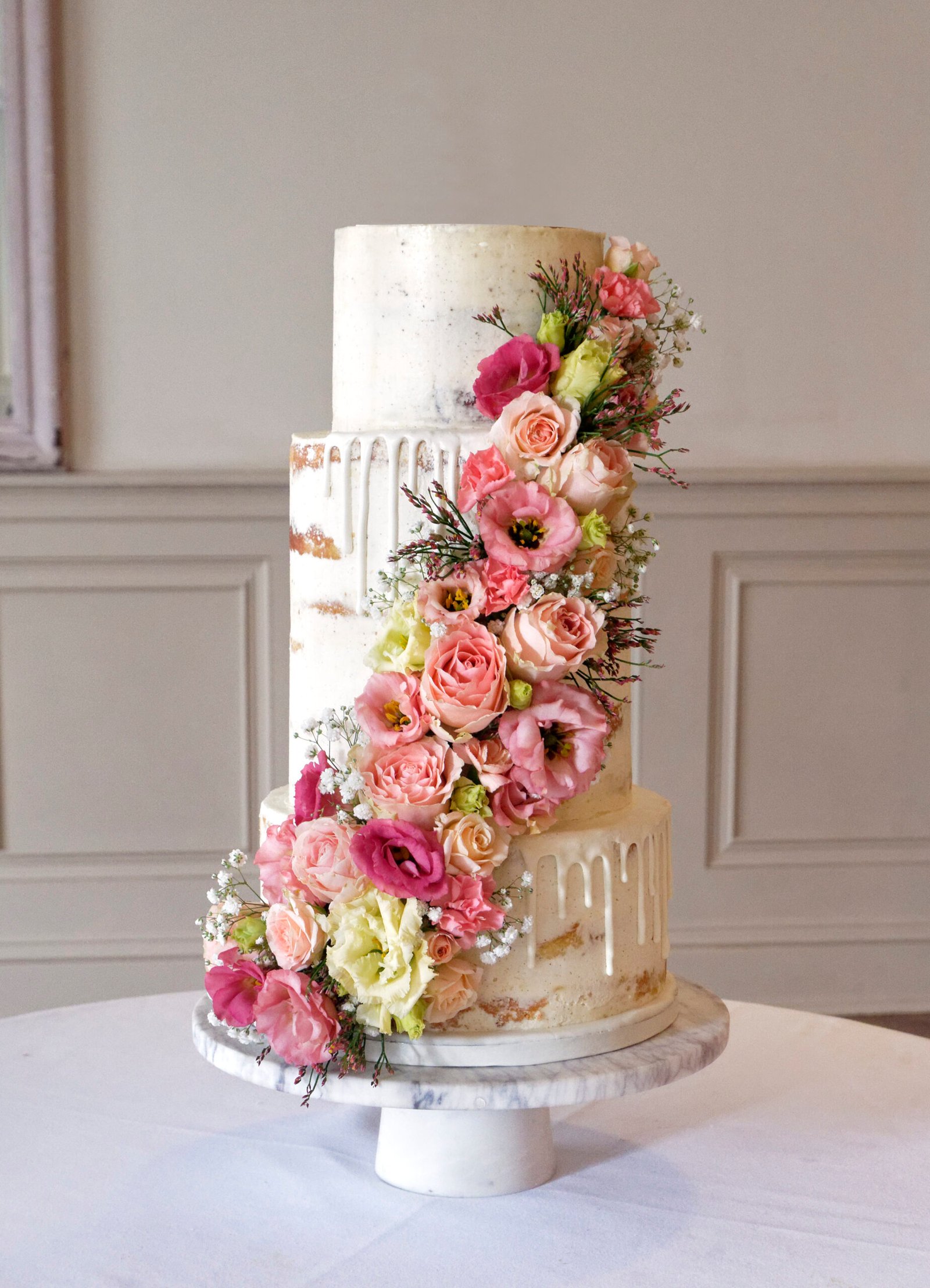 4 tier summer wedding cake with fresh flowers