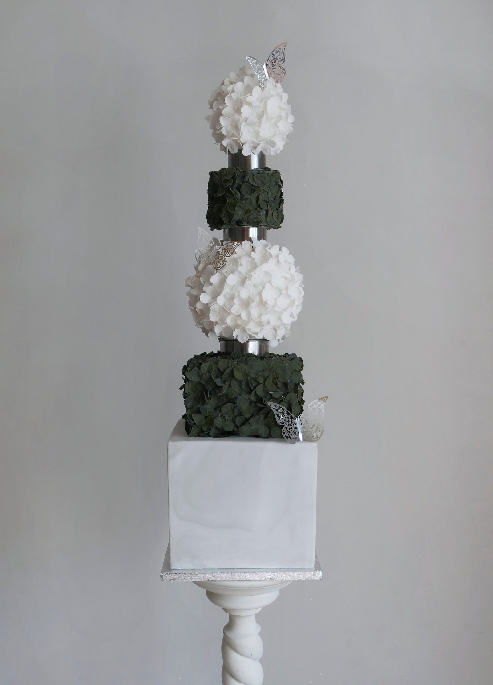 topiary style wedding cake with butterflys